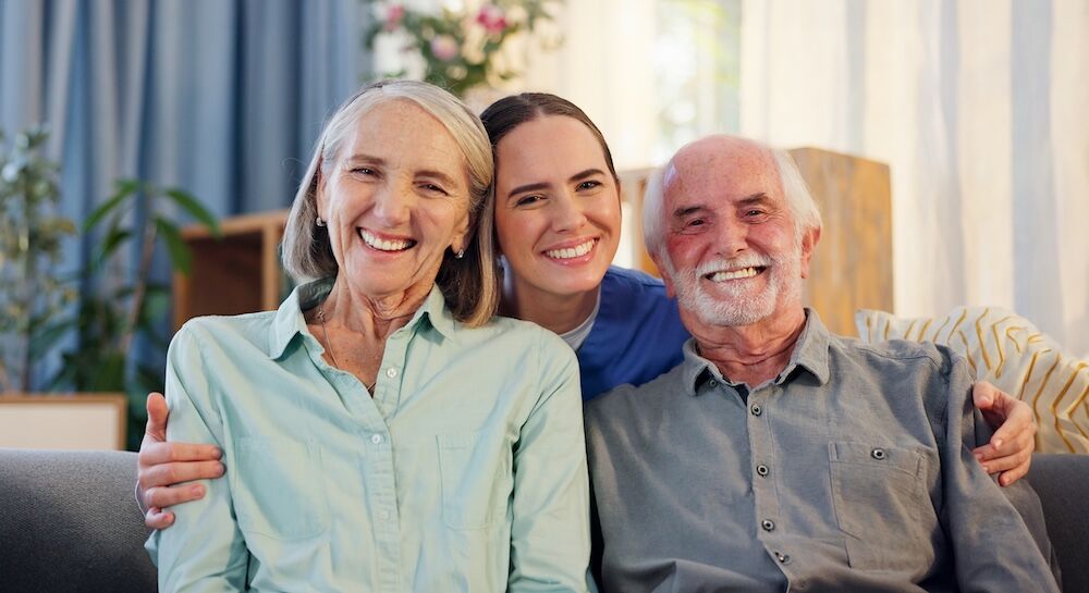 Senior couple happy at home with their home health care