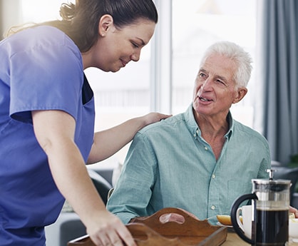 Home Care assistant helping a client