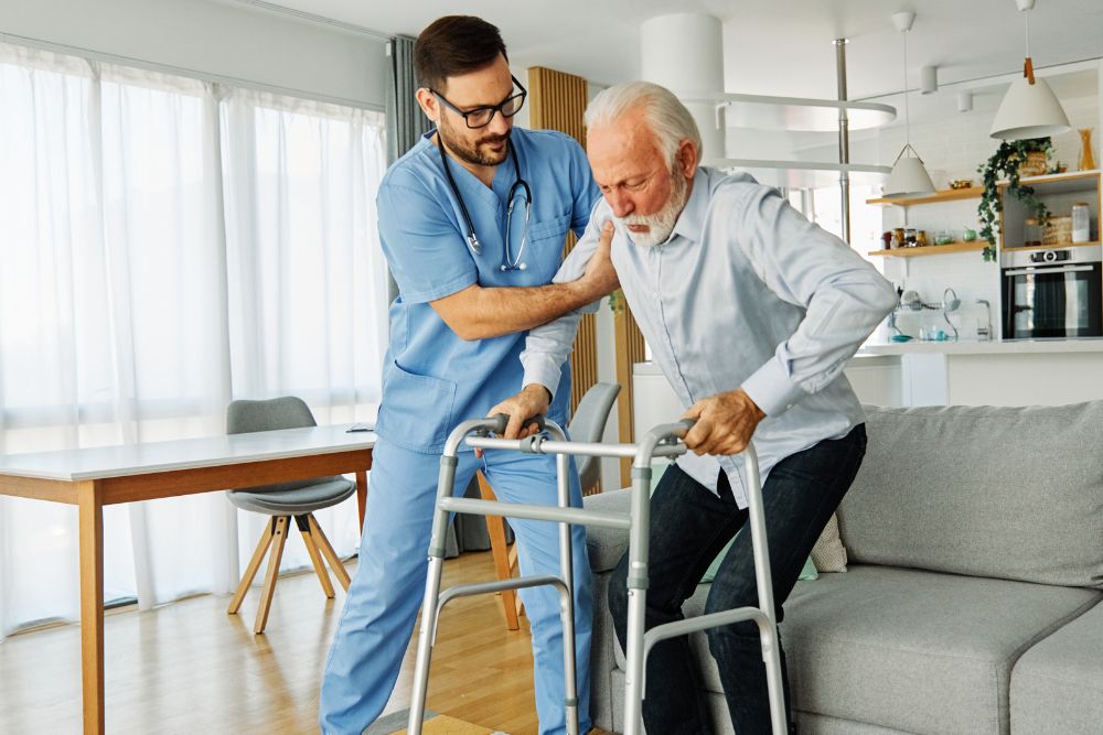 A home health aide providing home care services in Northville, MI to a senior man