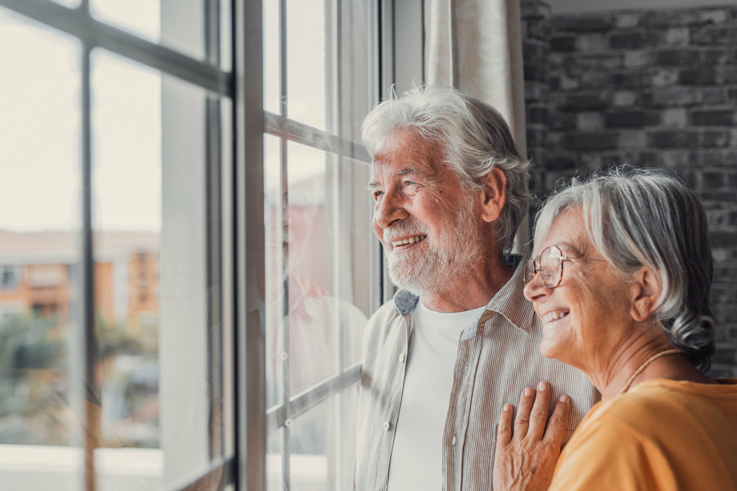 Senior couple in home care at home health care company in Michigan.