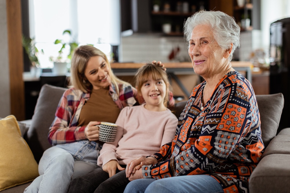 Senior woman with her family talking about the benefits of home health care